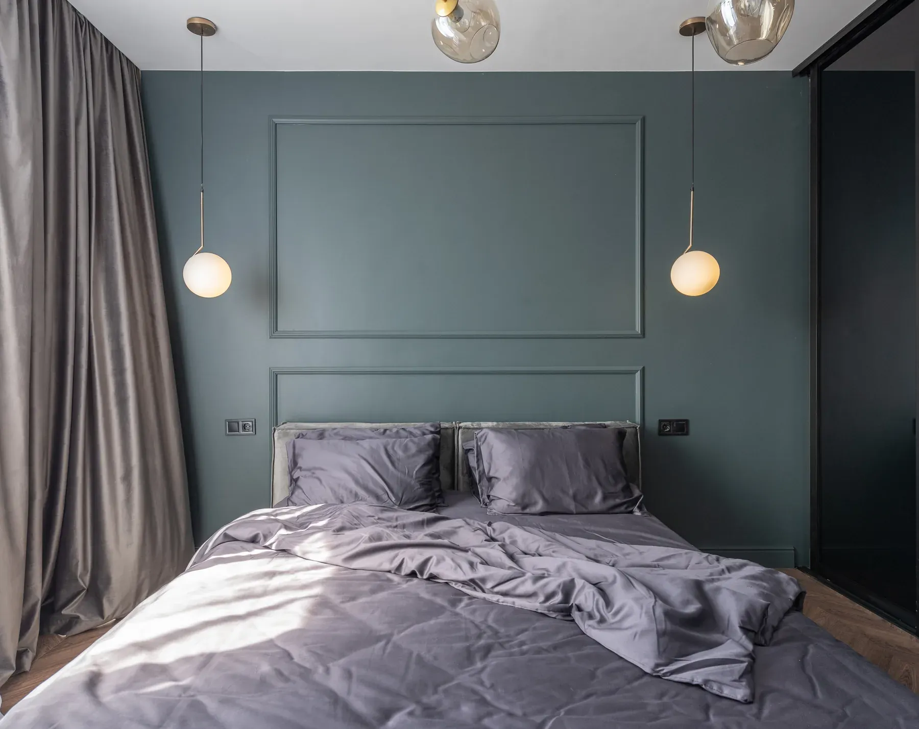 Neutral upholstered double bed against a panelled wall — reference image for the KHWAB upholstered bed