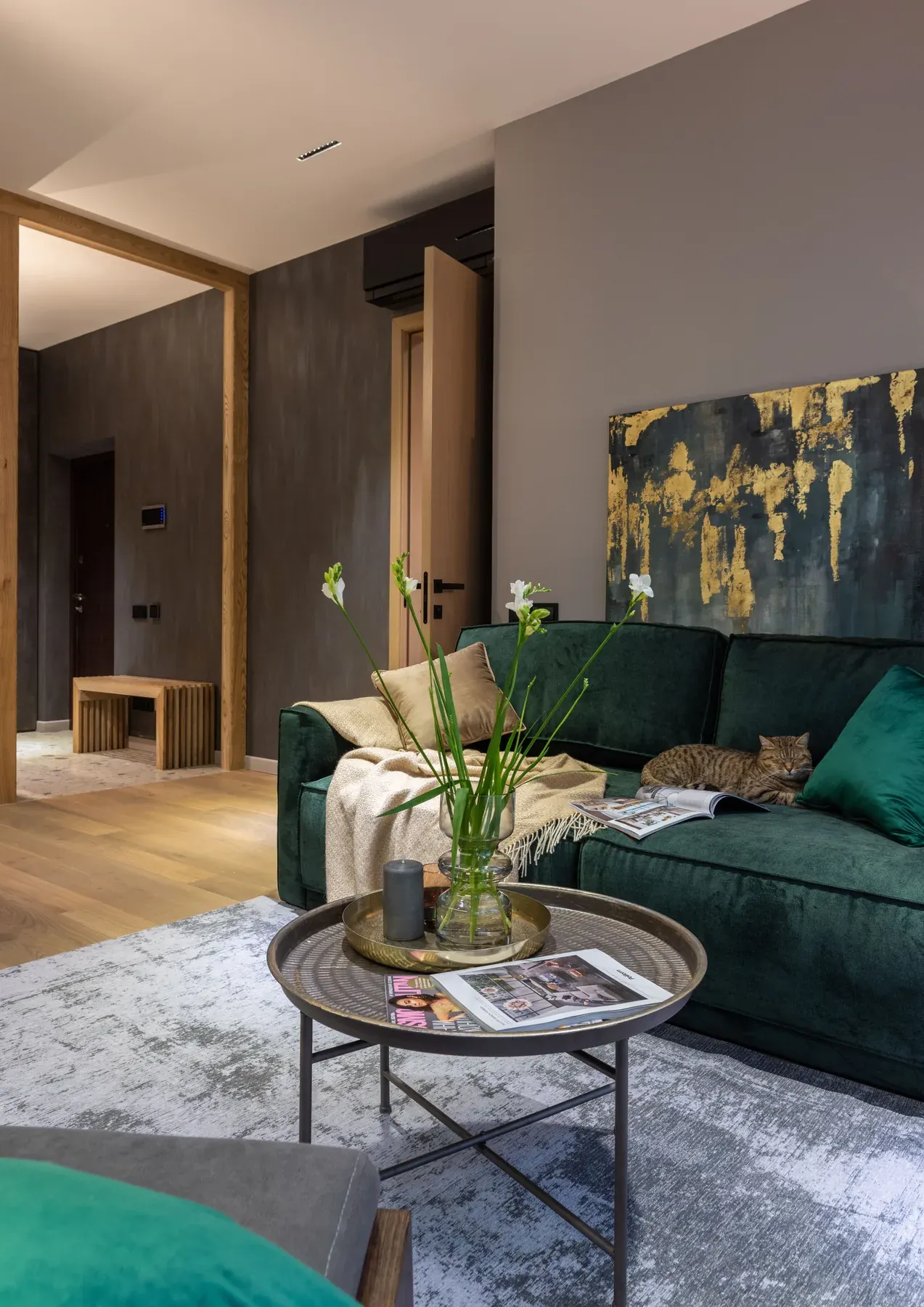 Dark green sofa with a round wooden coffee table — reference image for the GULZAR deep-seat fabric sofa