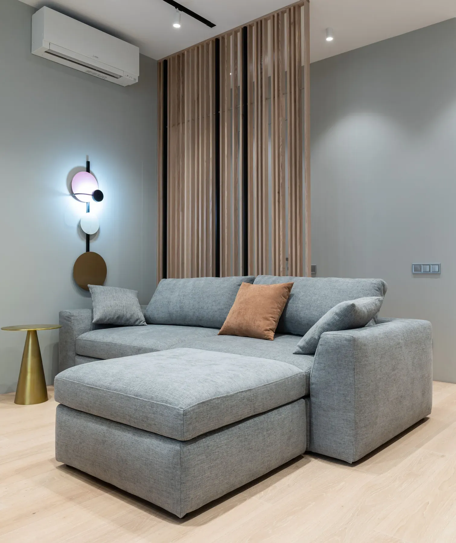 Modern grey sectional sofa in a contemporary interior — reference image for the DASTAN corner sectional sofa