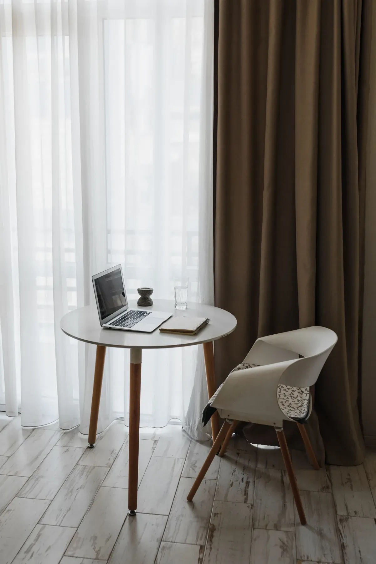 Compact round home-office desk with an upholstered chair — reference image for the TADBEER compact home desk