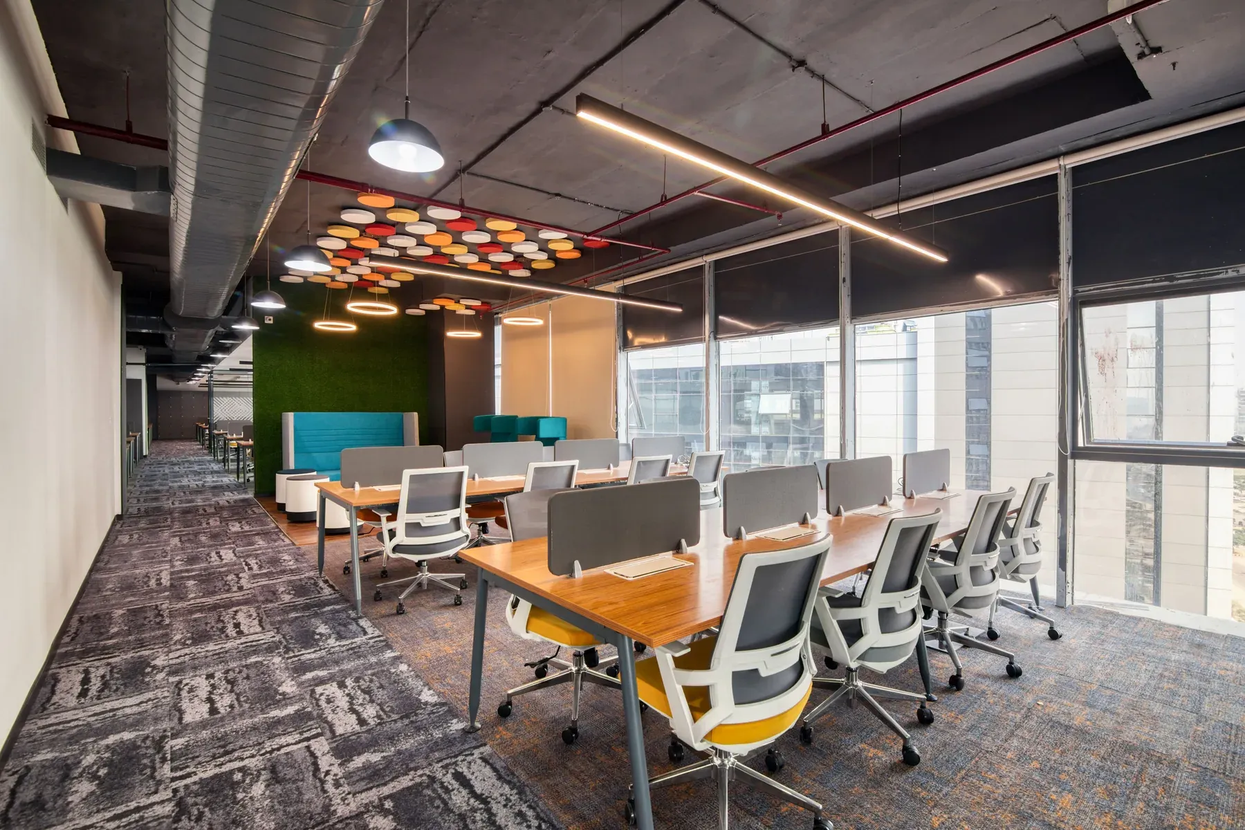 Shared office desks with modern task chairs — reference image for the HUNAR shared twin desk