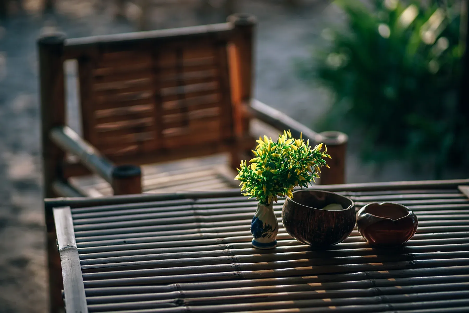 Bamboo outdoor table with a matching wooden chair — reference image for the SHAJAR bamboo table & chair