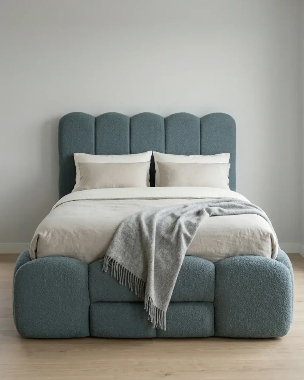 SAVERA Boucle Bed in blue-grey, front view from the foot of the bed
