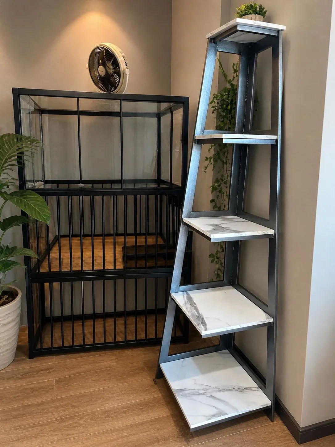 Five-tier ladder shelf with a grey metal frame and marble-look shelves beside a black metal display unit — photograph of the SEERHI shelf