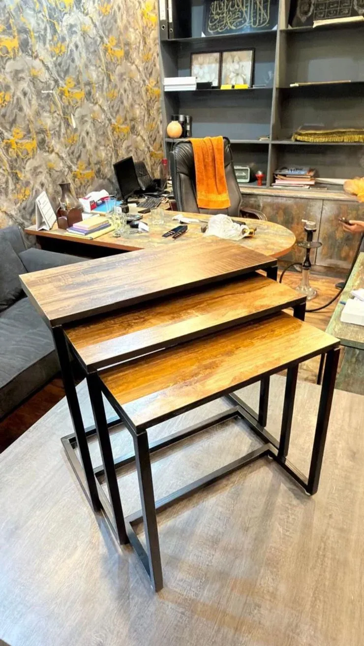 SILSILA nesting tables seen from the side, the three sizes tucked one under the next